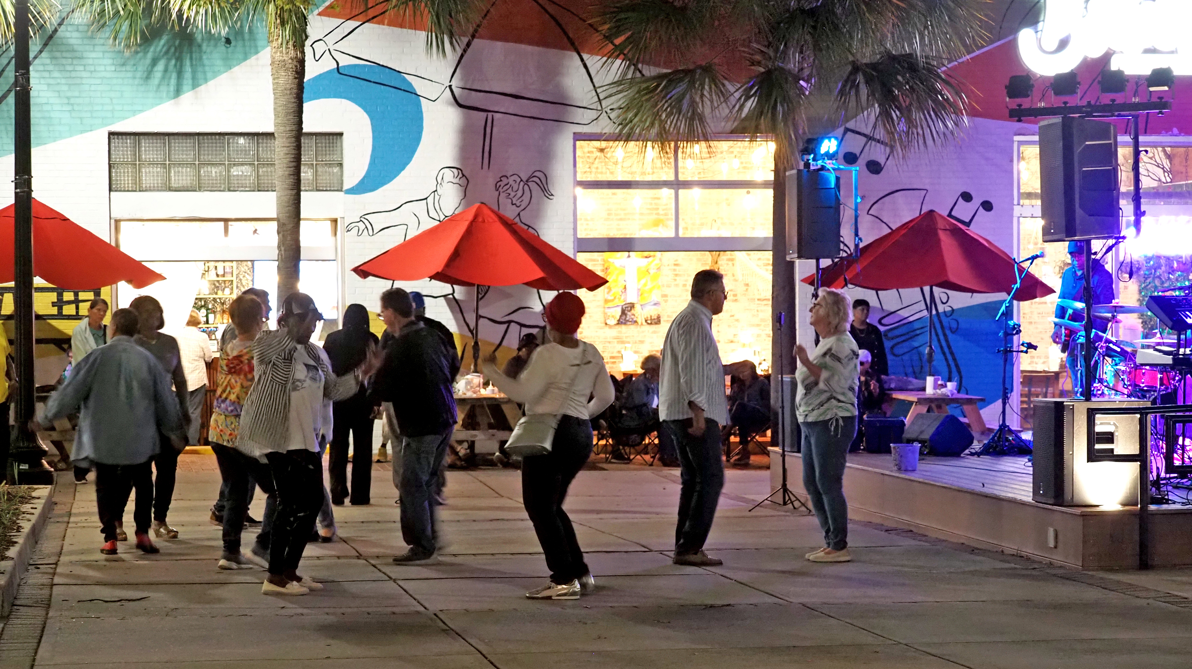 People dancing at a free fall concert in downtown Myrtle Beach during Fall Nights at Nance